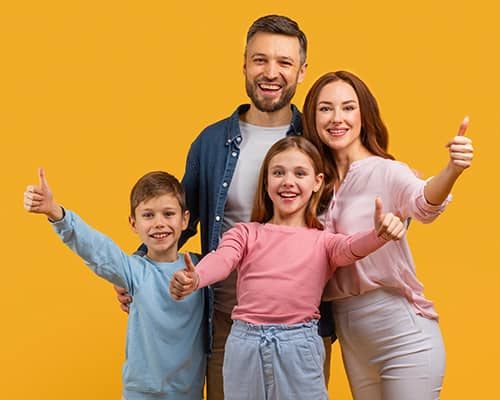 Happy family stands close together in their new house